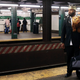 Ro'zaye Bellevue, dressed as Prince Akeem from the movie "Coming to America" for Halloween, waits for the train at the West 4 Street Station, Saturday, Oct. 31, 2015, in New York.